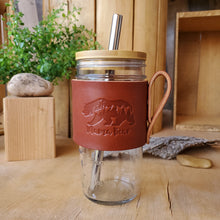 Load image into Gallery viewer, Mama Bear leather wrapped jar with hand and bamboo lid. Lid has a straw hole and comes with a boba 304 stainless steel. Made by Lazy 3 Leather Co.  