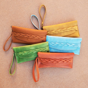 Leather wristlet clutch with leather braid. Tandy leather denver side in green, aqua, yellow, blue, and brick