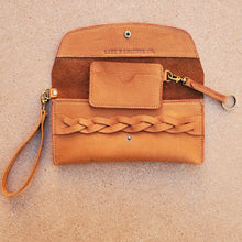Load image into Gallery viewer, Wristlet Leather Clutch with minimal wallet adorned with antique brass hardware. Made by Lazy 3 Leather Co in Tandy Leather&#39;s Cumberland side. 