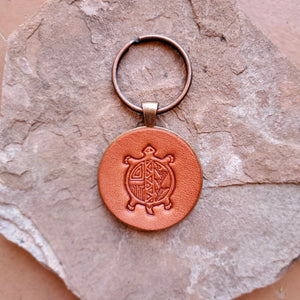 Leather turtle keychain on sandstone rock made by lazy 3 leather company.