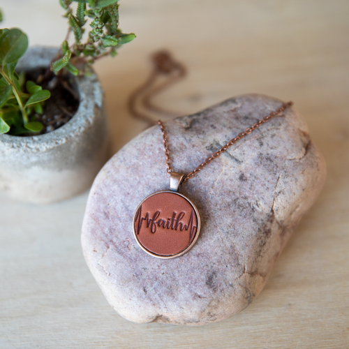 Faith heartbeat Leather pendant necklace made by Lazy 3 Leather Co. mounted in an antique copper pendant with matching chain