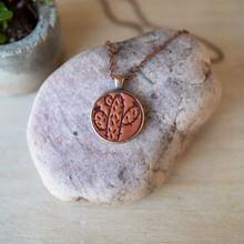 Load image into Gallery viewer, Prickly Pear stamped leather necklace mounted in antique copper pendant and has a matching chain made by lazy 3 leather co.
